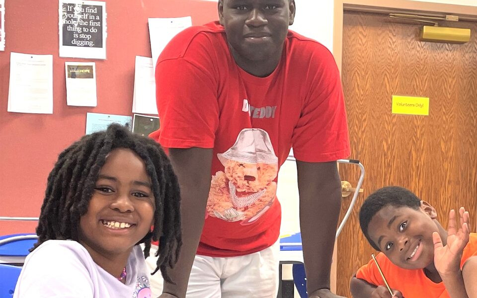 Lafayette Urban Ministry staff and children at a local youth program