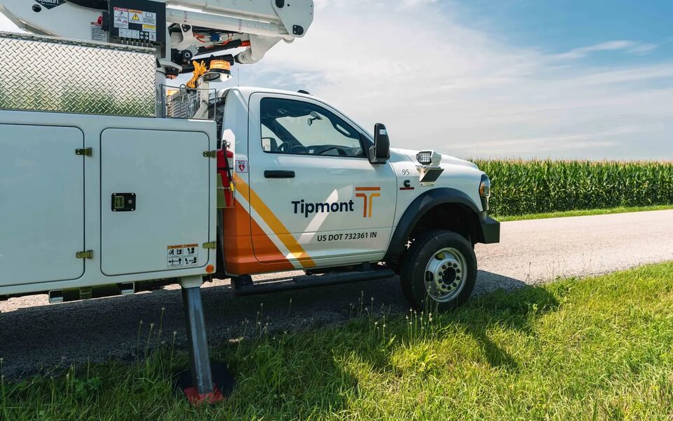 A Tipmont utility crew working beside a field in Tippecanoe County