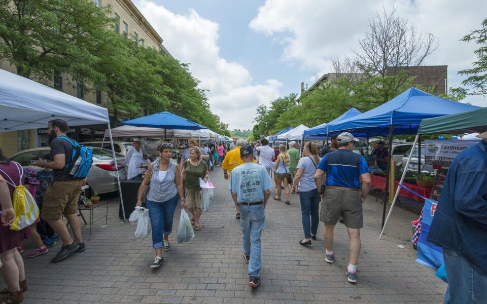 Shoppers walking through the Historic Lafayette Farmers Market downtown